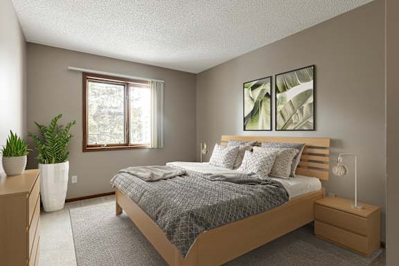 A bedroom with a bed, nightstand, and two potted plants.