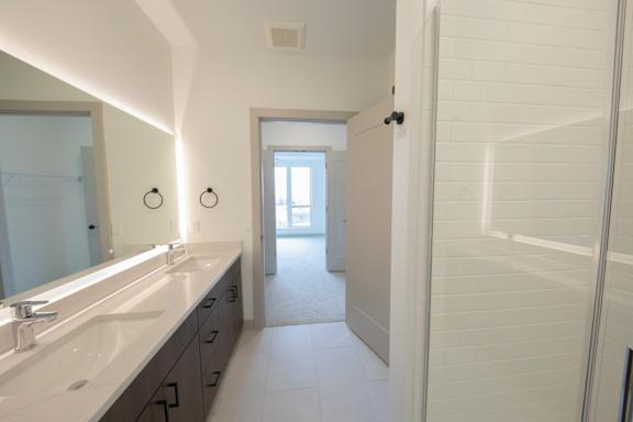 Primary bathroom in the C4 two bedroom two bathroom floor plan at The Mera in St. Louis Park, Minnesota