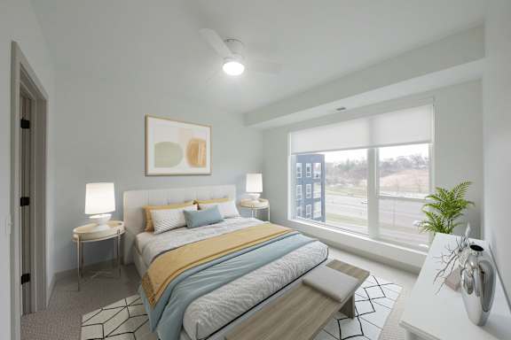 Primary bedroom in the CC3 two bedroom plus den, two bathroom floor plan at The Mera in St. Louis Park, Minnesota