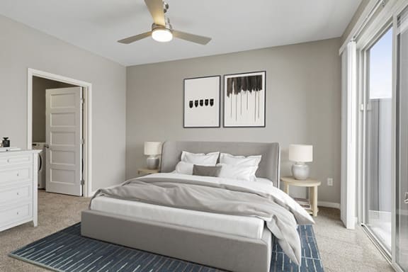 Bedroom with bed, ceiling fan and light at Nuvelo at Parkside, Apple Valley, MN