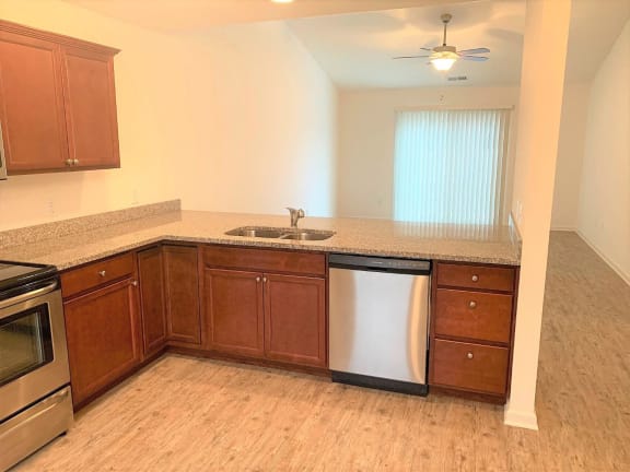 Kitchen with wooden cabinets at Hawthorne Properties, Lafayette, IN, 47905