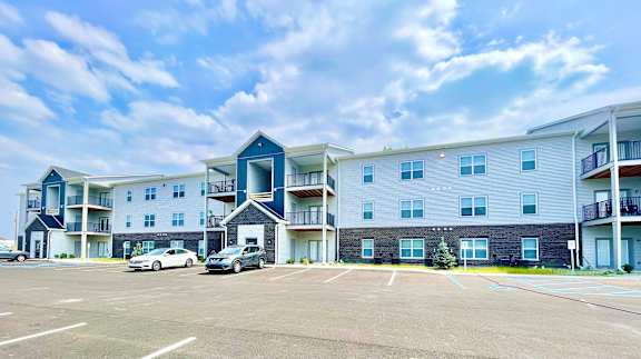 A large apartment complex with a parking lot in front.at Concord Crossing, Indiana, 47909