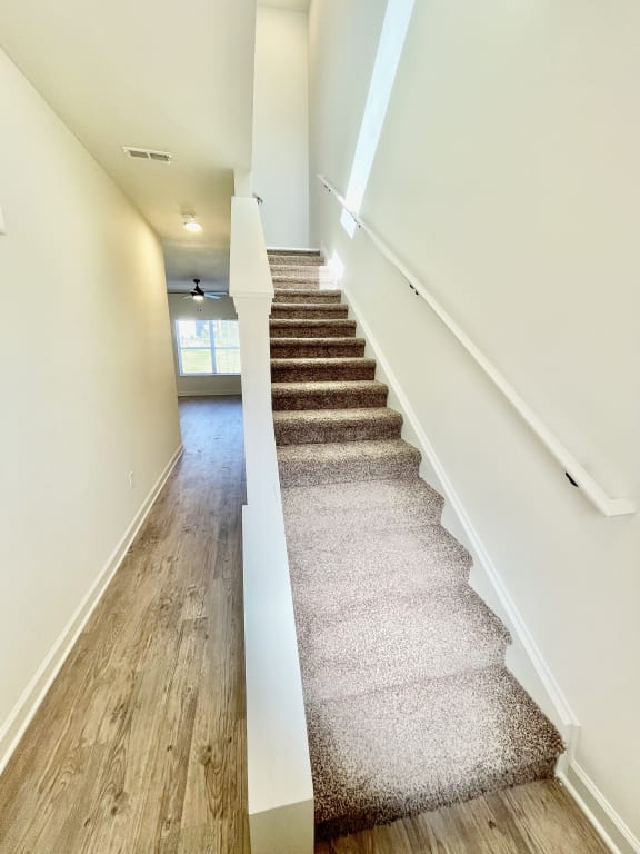 view of entryway, stairs leading to bedrooms & hall leading to kitchen and living room at Murdock Gardens Apartments, Lafayette, IN 47904