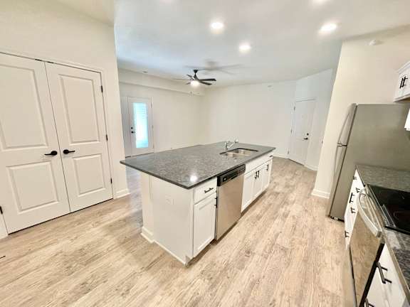 A kitchen with white cabinets and a black countertop.at Concord Crossing, Lafayette, 47909