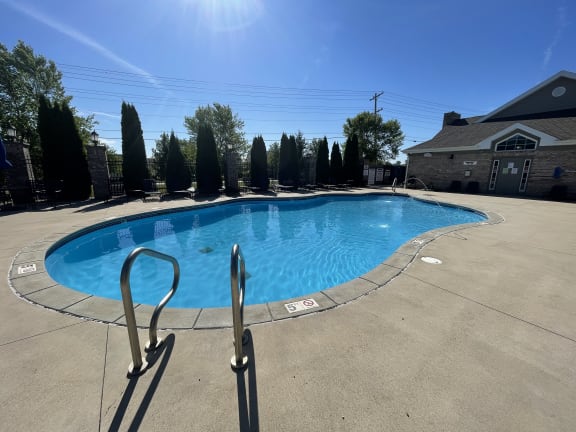 a resort style pool is shown in front of a house at Hawthorne Properties in Lafayette, IN 47905