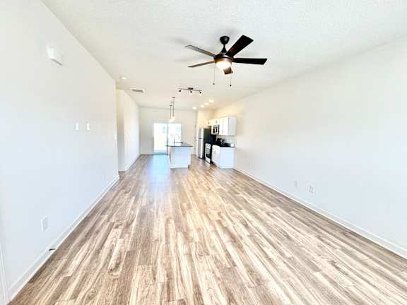 A room with a ceiling fan and lighting fixture.at Concord Crossing, Lafayette, IN