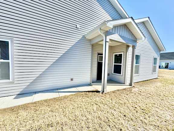 A house with a grey siding and a white roof.at Concord Crossing, Lafayette, 47909