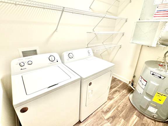 A washer and dryer in a small room.at Concord Crossing, Lafayette