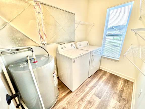 A room with a water heater and a washer and dryer.at Concord Crossing, Lafayette, 47909