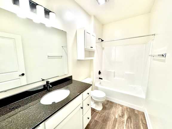 A bathroom with a sink, toilet, and bathtub.at Concord Crossing, Lafayette, 47909