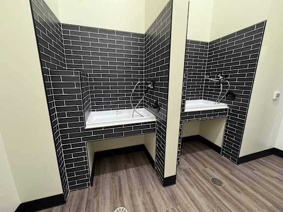 A bathroom with two sinks and a mirror.at Concord Crossing, Lafayette Indiana
