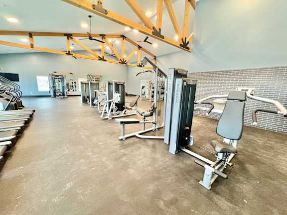 A gym with a variety of equipment including a leg press machine.at Concord Crossing, Lafayette, IN 47909