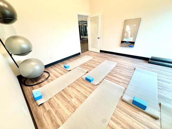 A yoga studio with mats and blocks on the floor.at Concord Crossing, Lafayette, IN
