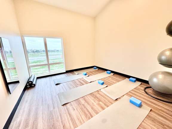 A room with yoga mats and blocks on the floor.at Concord Crossing, Lafayette, 47909