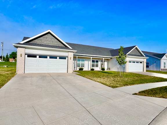 A two-story house with a garage is shown.
