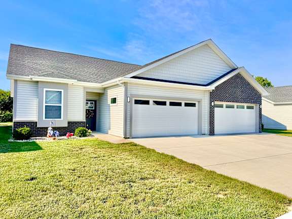 A two-car garage is attached to a house.