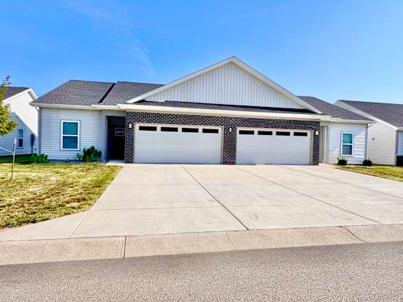 A two-car garage is attached to a house.