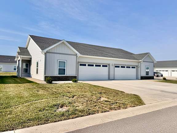 A two-car garage is attached to a house.