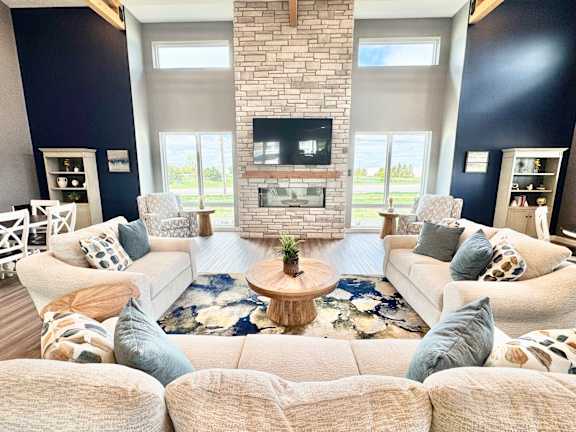 A living room with a fireplace and a television.
