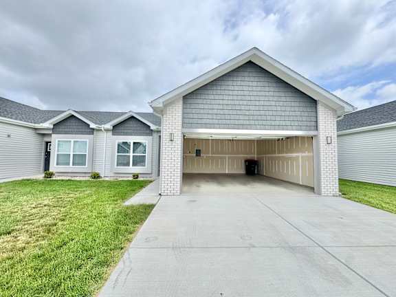A two-story house with a garage.