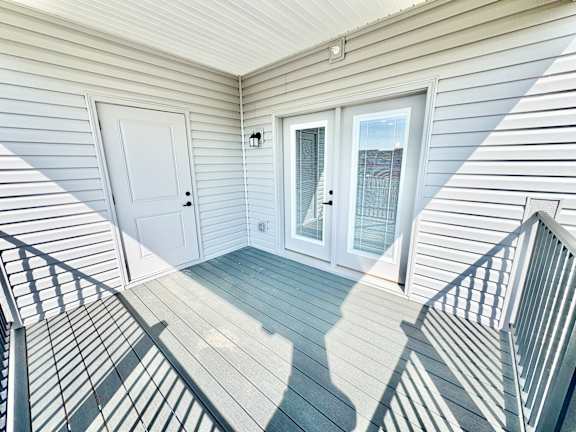 A white door is on the left and a glass door is on the right.