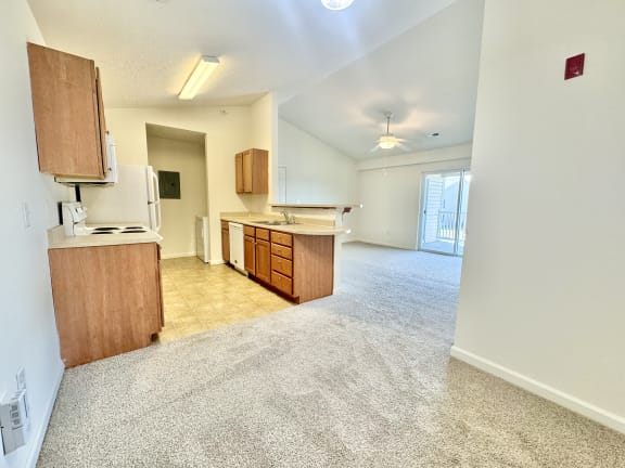 an empty kitchen and living room with an open floor plan at Hawthorne Properties in Lafayette, IN 47905