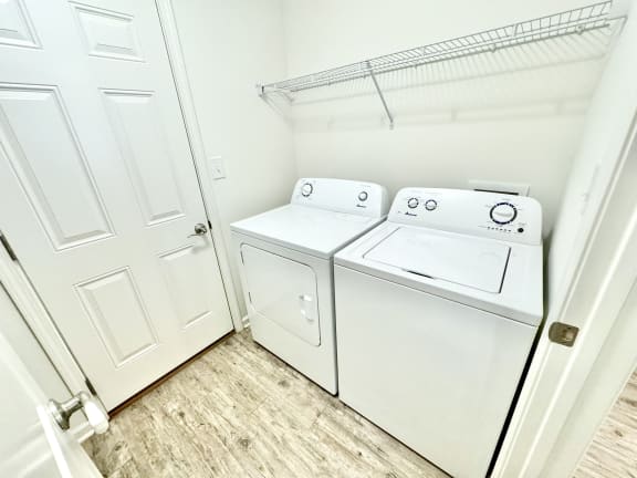 the laundry room has a washer and dryer and a door to the closet at Hawthorne Properties in Lafayette, IN 47905