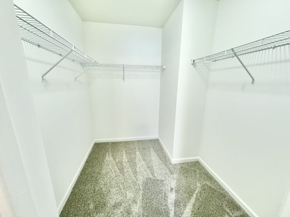 an empty closet with empty shelves in a room with white walls at Hawthorne Properties in Lafayette, IN 47905