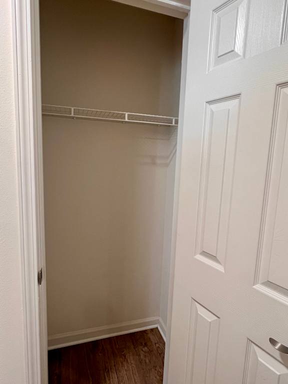 A white door with a white interior and a white shelf above it.