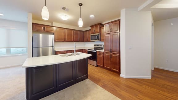 a kitchen with wooden cabinets and a white counter top