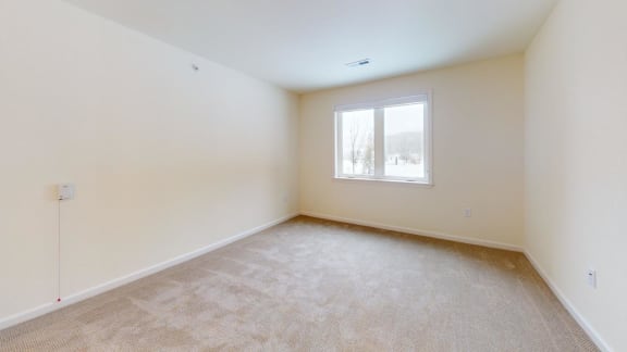 a room with carpet and a window