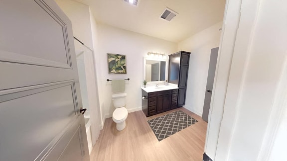 a bathroom with a toilet and a sink