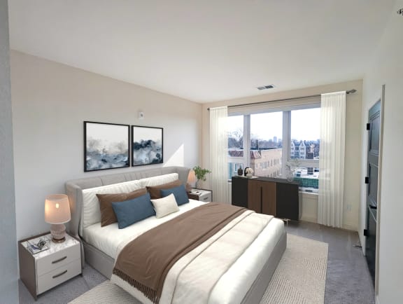 a white bedroom with a large bed and a large window