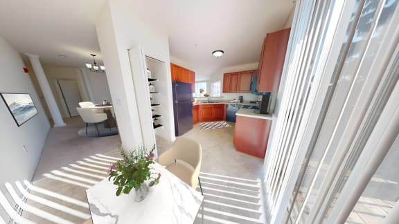a view of a kitchen and a living room from a staircase
