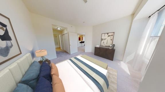 a bedroom with a large bed and a couch