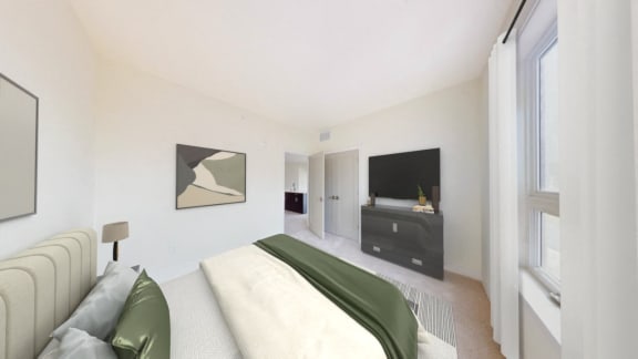 the master bedroom has a large bed and a tv in the corner
