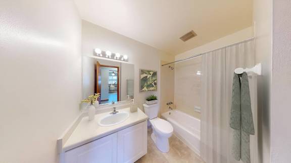 a bathroom with a sink toilet and a shower