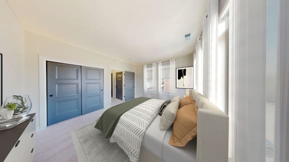 A bedroom with a bed, a dresser, and a mirror.