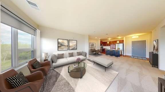A living room with a couch, chairs, and a coffee table.