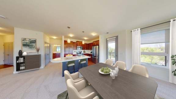A dining room with a table set for six.