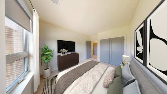 A living room with a grey couch and a brown coffee table.