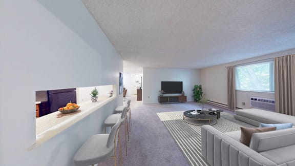 A living room with a grey couch, a coffee table, and a television.