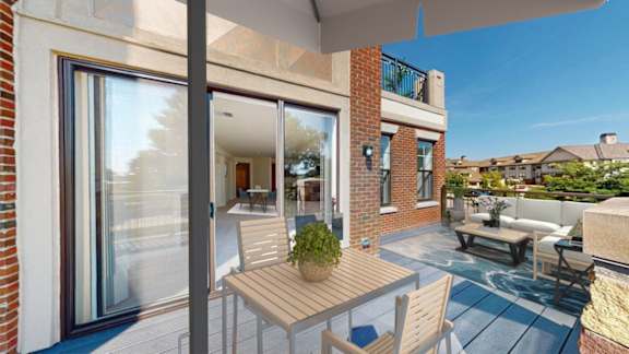 A patio with a table and chairs is shown.