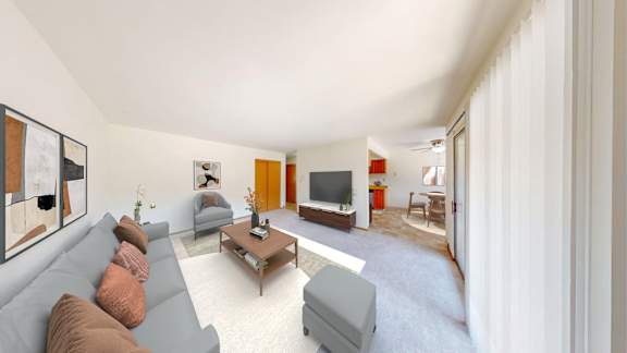 A living room with a grey couch and a coffee table.