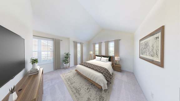 A bedroom with a large bed and a flat screen TV.