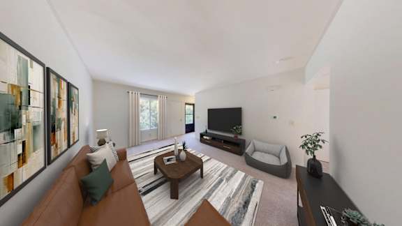 A living room with a brown couch, a coffee table, a television, and a rug.