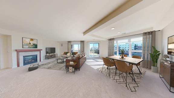 A spacious living room with a fireplace, a dining table set for six, and a large window overlooking the city.