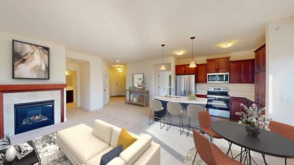 A modern living room with a fireplace and a dining area.