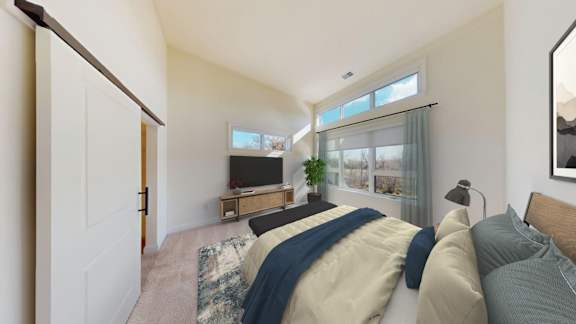 A living room with a couch and a television.