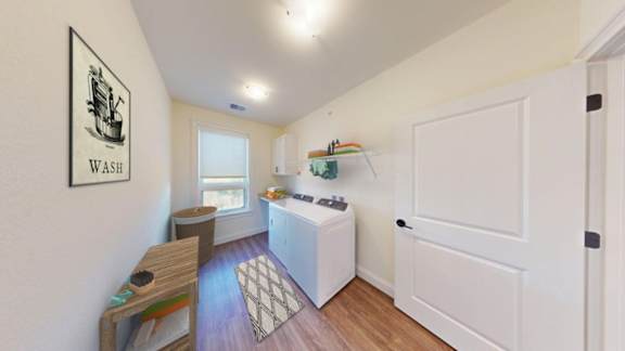 A bathroom with a wash basin and a window.
